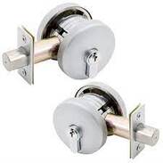 Picture two matching satin chrome deadbolts.