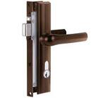 Picture black metal security screen door lock showing front part of primary metal casing with chrome metal locking tongue protruding inside and outside handles at right angles to frame chrome profile lock cylinder below handles